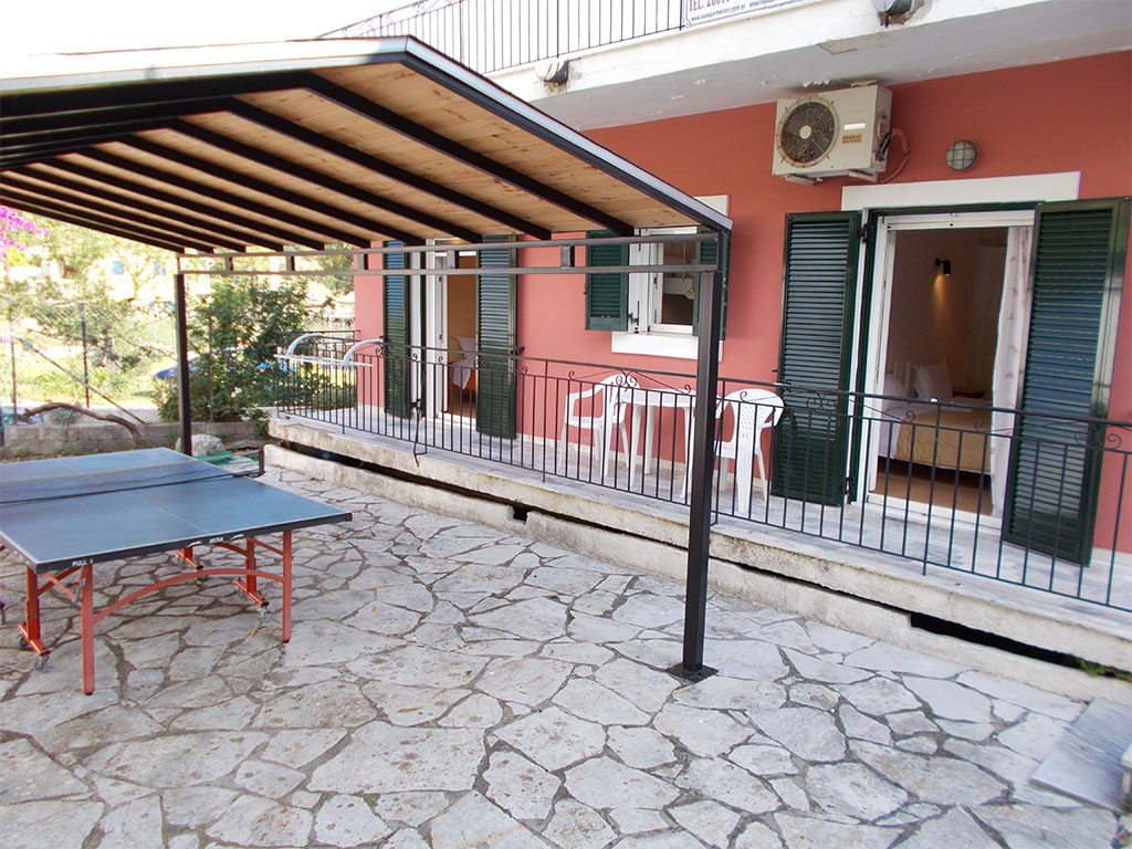 Eva apartments, Kassiopi, Imerolia, Yard with Ping Pong table in apartment 2 1